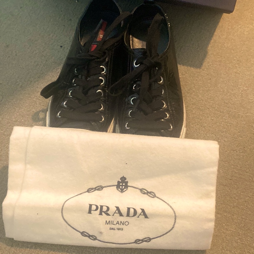 Prada Low top every day shoes. Black with white trim . Size 7. Original box.